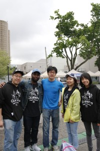Founder John Wang and the market’s volunteers.