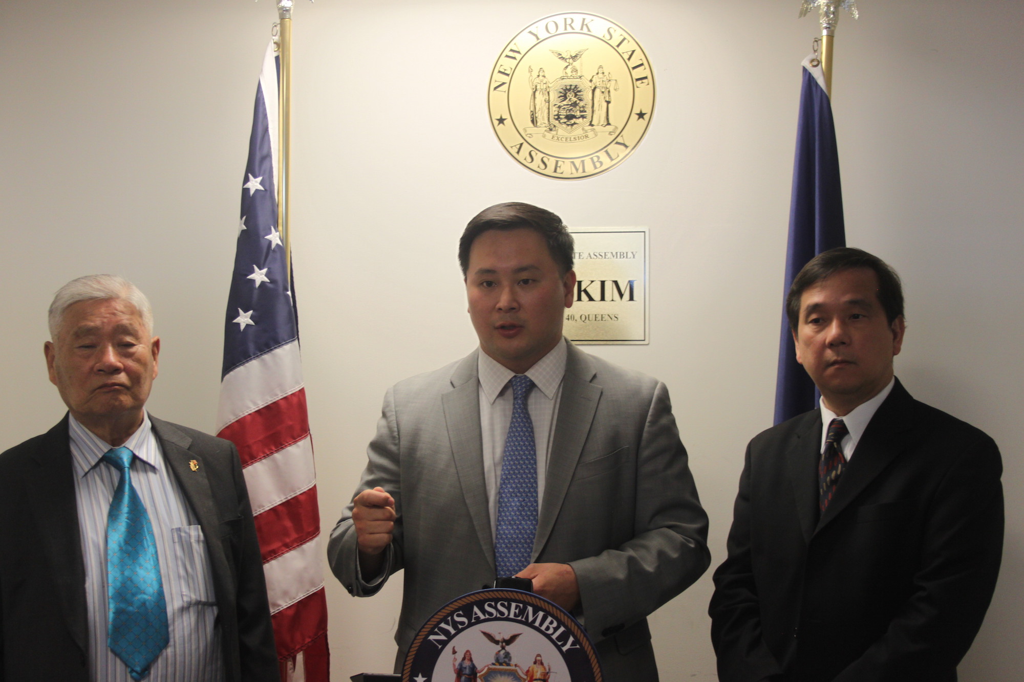 Assemblyman Ron Kim, center
